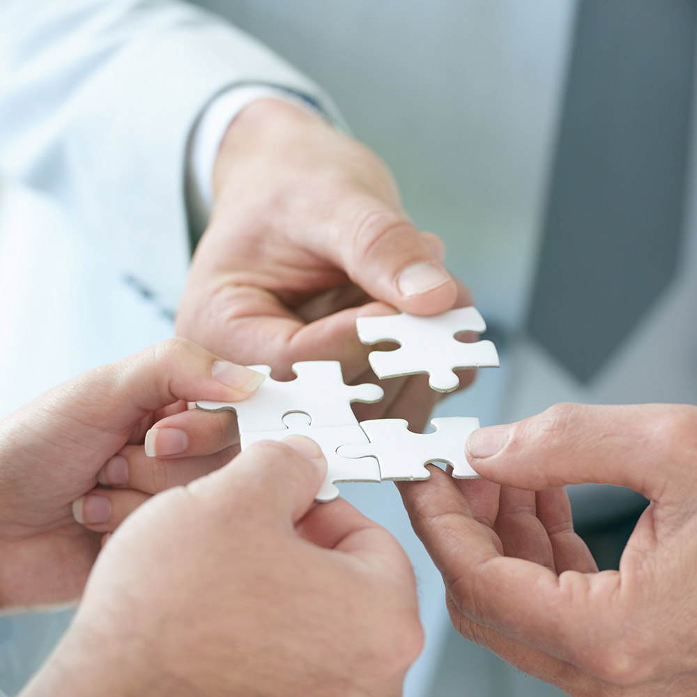 Puzzle, company and partnership for collaboration, planning and teamwork for hope and goals. Hands, connection and trust for business, solutions and vision for support, idea and investment for people.